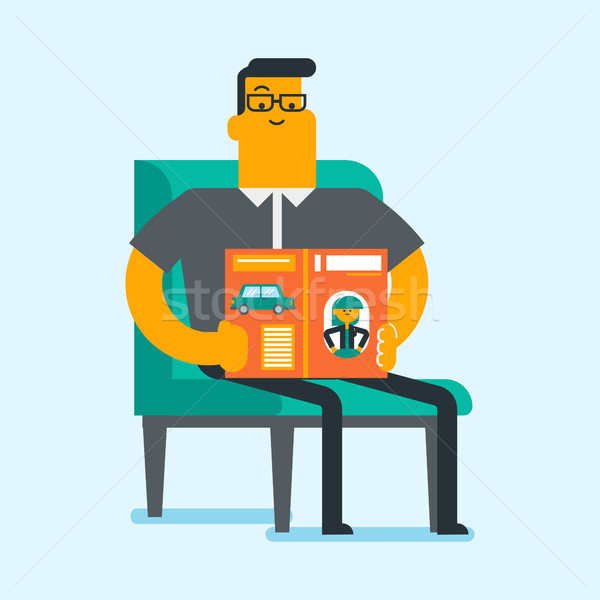 Stock photo: Caucasian white man reading a magazine.