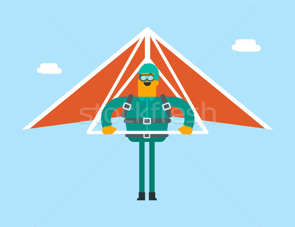 Caucasian white man flying on hang-glider. Stock photo © RAStudio
