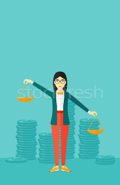 Stock photo: Business woman with scales.