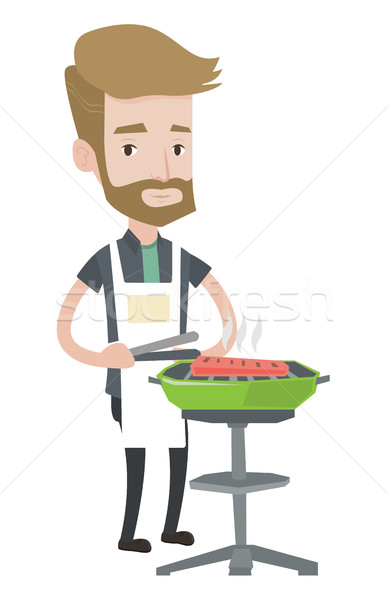 Stockfoto: Jonge · man · koken · vlees · barbecue · man