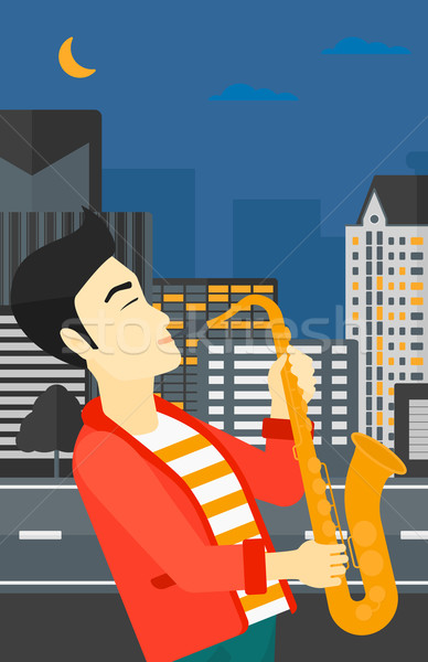 Musicien jouer saxophone asian homme nuit [[stock_photo]] © RAStudio