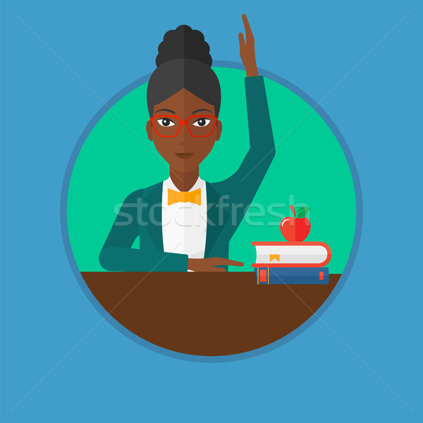 Student raising hand in class for an answer. Stock photo © RAStudio