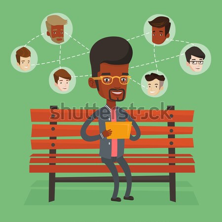 Stock photo: Man surfing in the social network.