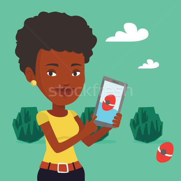 Femme jouer action jeu smartphone jeunes [[stock_photo]] © RAStudio