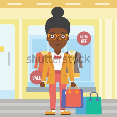 Boldog nő szatyrok tart bevásárlótáskák butik Stock fotó © RAStudio