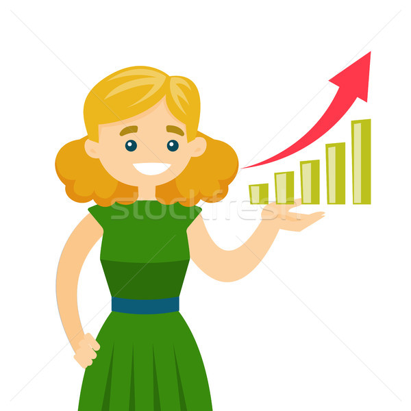 Stock photo: Young business woman pointing at chart going up.