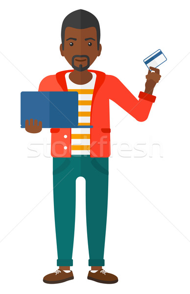 Człowiek online laptop karty kredytowej Zdjęcia stock © RAStudio