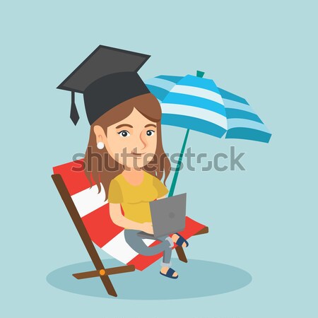 Graduate lying in chaise lounge with laptop. Stock photo © RAStudio
