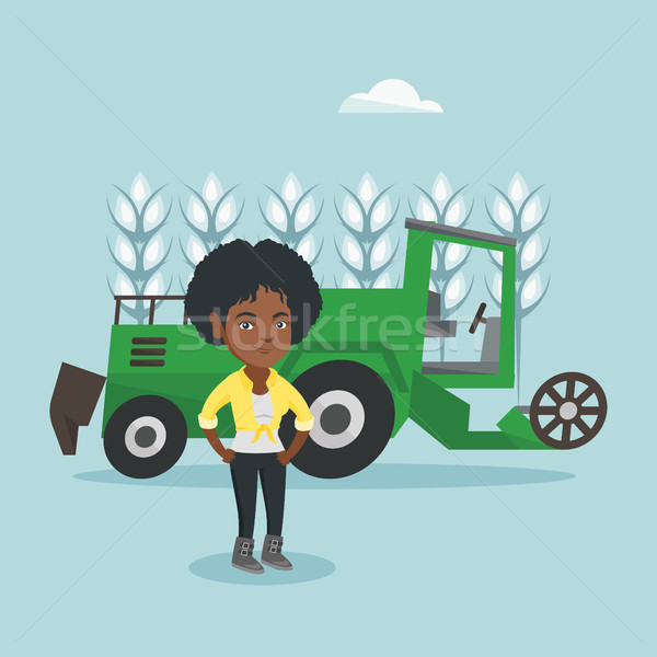 Farmer standing on the background of combine. Stock photo © RAStudio