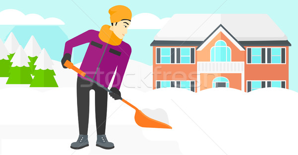 Man shoveling and removing snow. Stock photo © RAStudio