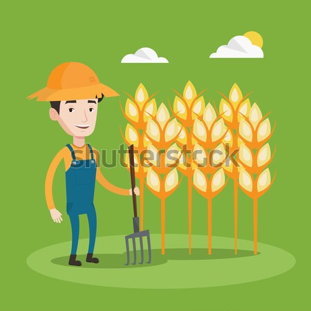 Farmer with pitchfork vector illustration. Stock photo © RAStudio