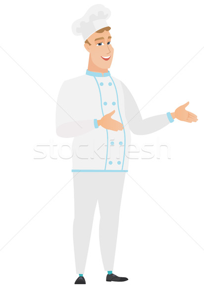 Young caucasian happy chef cook gesturing. Stock photo © RAStudio