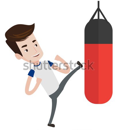 Man exercising with punching bag. Stock photo © RAStudio