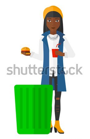 Woman throwing junk food. Stock photo © RAStudio