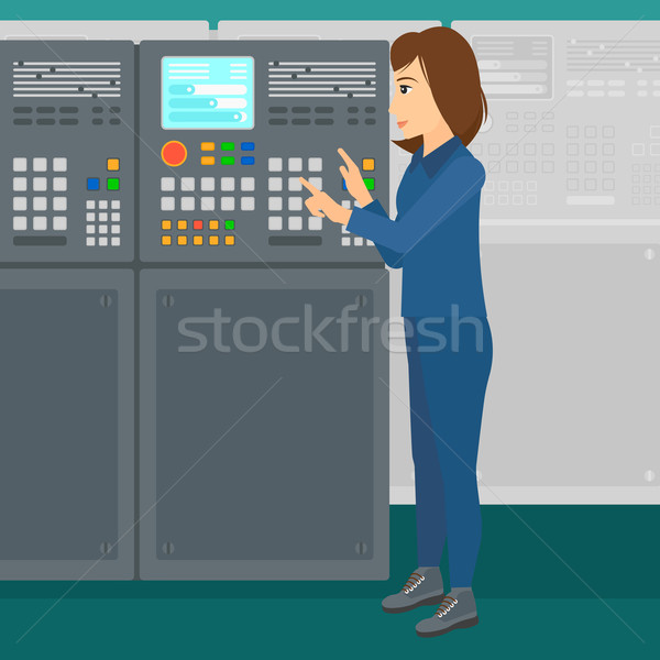 Stock photo: Engineer standing near control panel.
