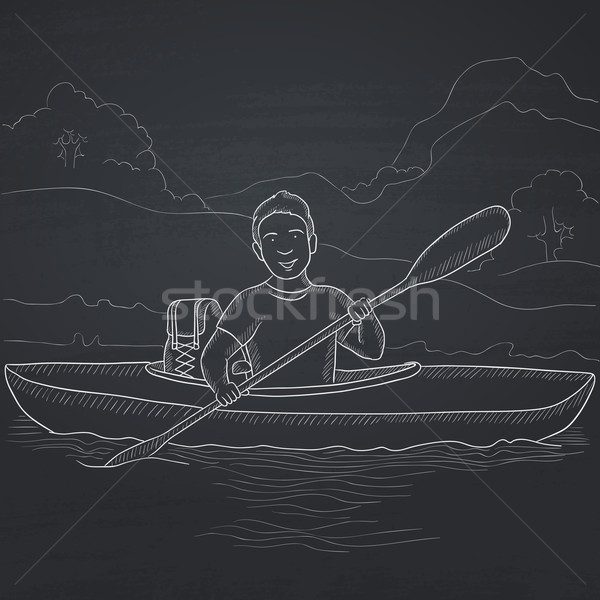 Stock photo: Man canoeing on the river.