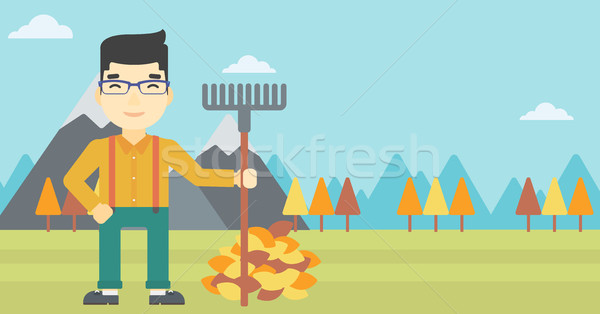 Man raking autumn leaves vector illustration. Stock photo © RAStudio
