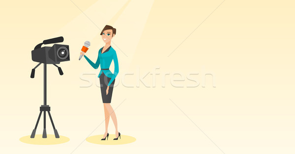 TV reporter with a microphone and a camera. Stock photo © RAStudio