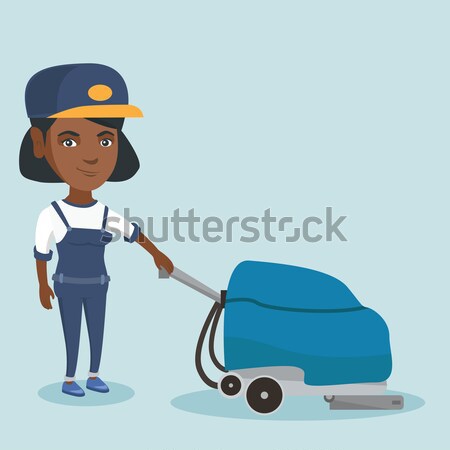 Female worker cleaning store floor with machine. Stock photo © RAStudio