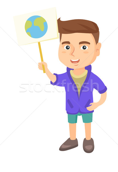 Caucasian boy holding a placard with planet. Stock photo © RAStudio
