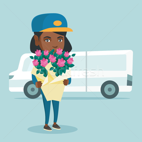 Delivery courier holding bouquet of flowers. Stock photo © RAStudio