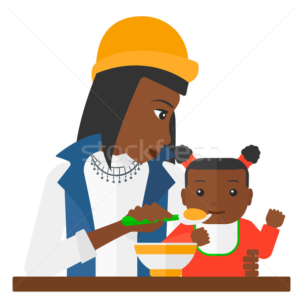 Woman feeding baby. Stock photo © RAStudio