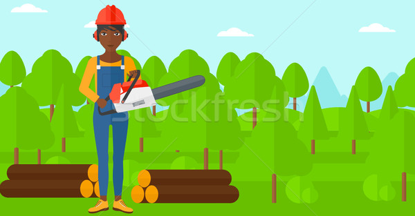 Stock photo: Lumberjack with chainsaw.