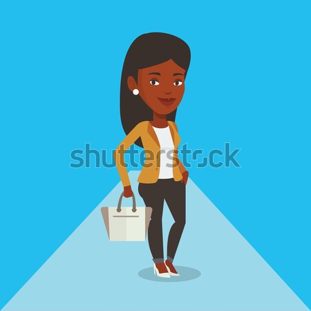 Woman posing on catwalk during fashion show. Stock photo © RAStudio