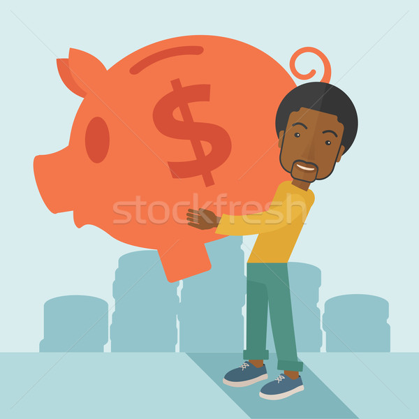 African businessman carries a big piggy bank for saving money. Stock photo © RAStudio