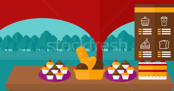 Background of bakery with table full of bread and pastries. Stock photo © RAStudio