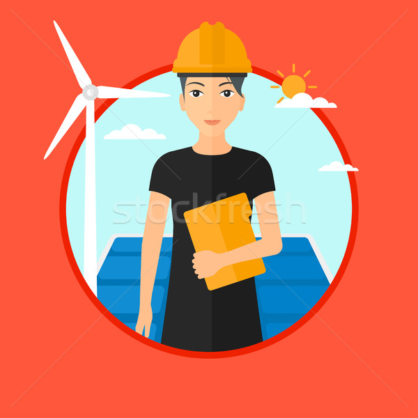 Female worker of solar power plant and wind farm. Stock photo © RAStudio