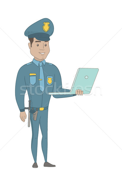 Young hispanic policeman using a laptop. Stock photo © RAStudio