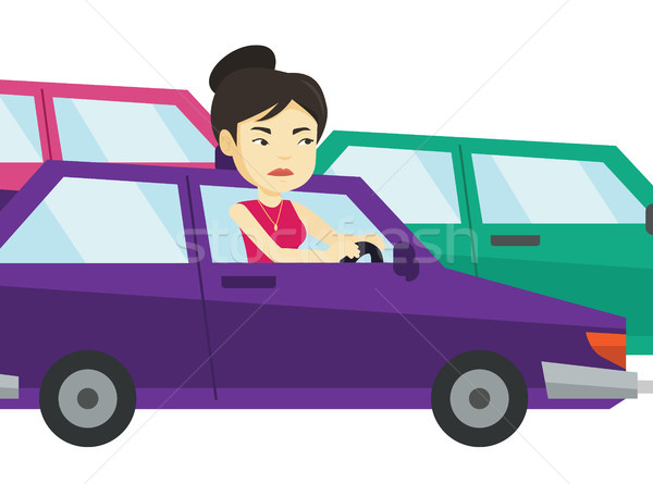Supărat asiatic femeie maşină trafic blocat Imagine de stoc © RAStudio