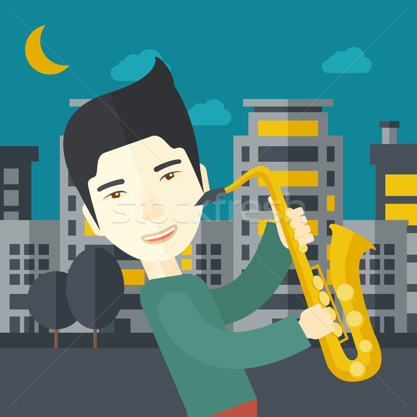 Asian musicien jouer saxophone rues nuit [[stock_photo]] © RAStudio