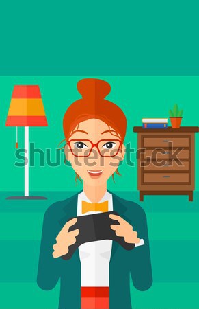 Woman playing video game. Stock photo © RAStudio