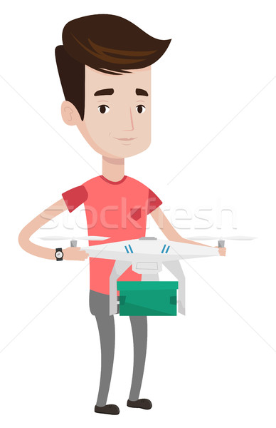 Man controlling delivery drone with post package. Stock photo © RAStudio