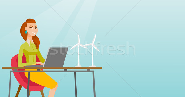 Woman working with model of wind turbines. Stock photo © RAStudio