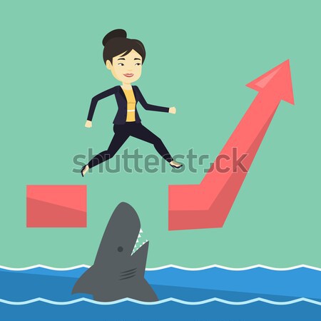 Business man jumping over ocean with shark. Stock photo © RAStudio