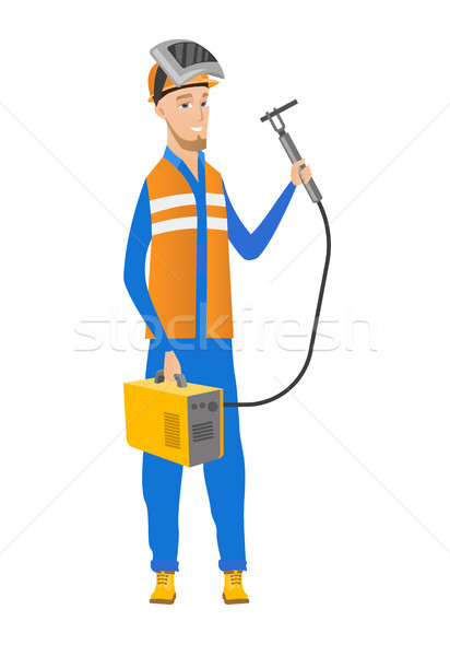 Stock photo: Young caucasian welder holding gas welding machine