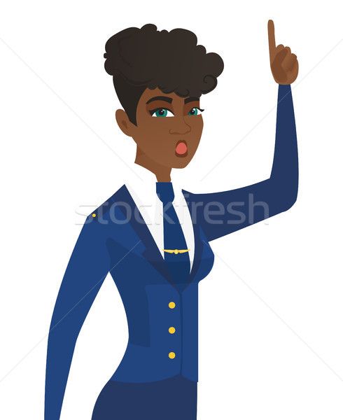 Stewardess with open mouth pointing finger up. Stock photo © RAStudio