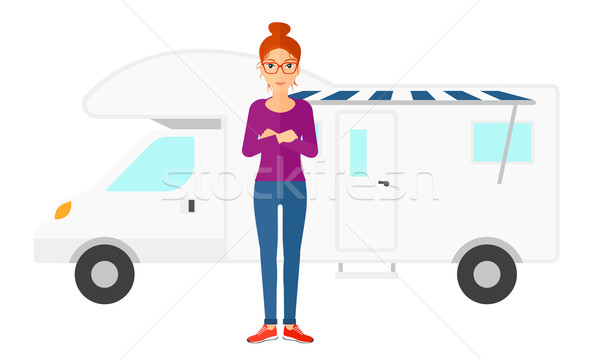 Stock photo: Woman standing in front of motor home.