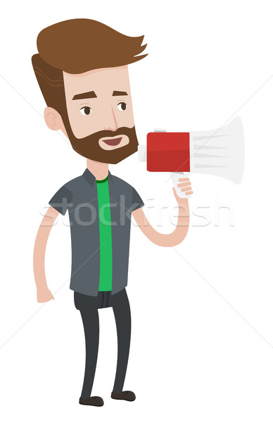 Stock photo: Young hipster man speaking into megaphone.