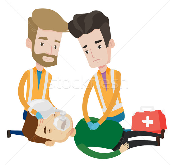 Stock photo: Emergency doctors carrying man on stretcher.