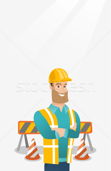 Confident builder with arms crossed. Stock photo © RAStudio