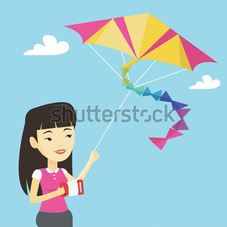 Young woman flying kite vector illustration. Stock photo © RAStudio