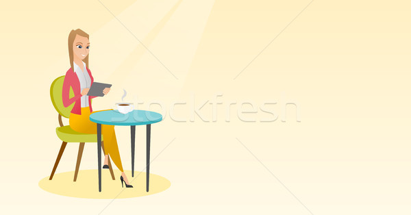 Woman surfing in the social network in the cafe. Stock photo © RAStudio