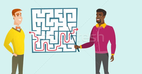 Business men looking at labyrinth with solution. Stock photo © RAStudio