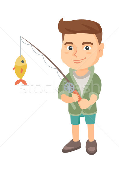 Little boy holding fishing rod with fish on hook. Stock photo © RAStudio