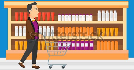 Customer with trolley. Stock photo © RAStudio