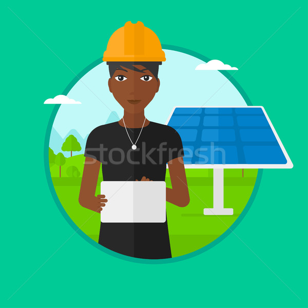 Femminile lavoratore energia solare impianto Foto d'archivio © RAStudio